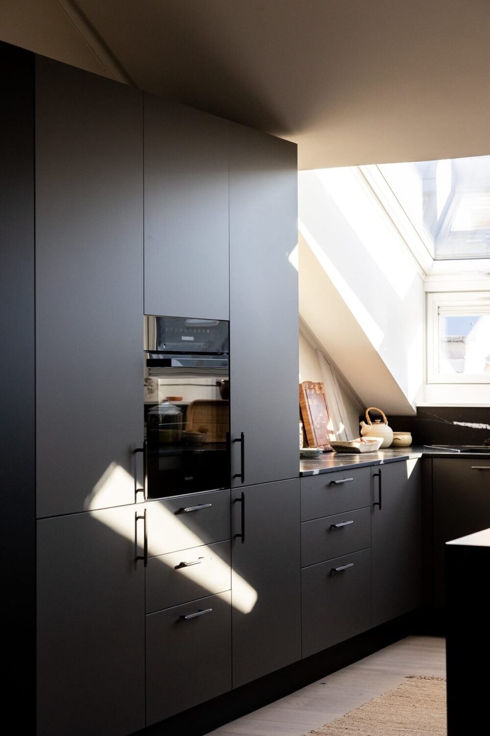 A Bright Penthouse Apartment in Oslo 7 black-cupboards-modern-kitchen-scandinavian-penthouse-nordroom