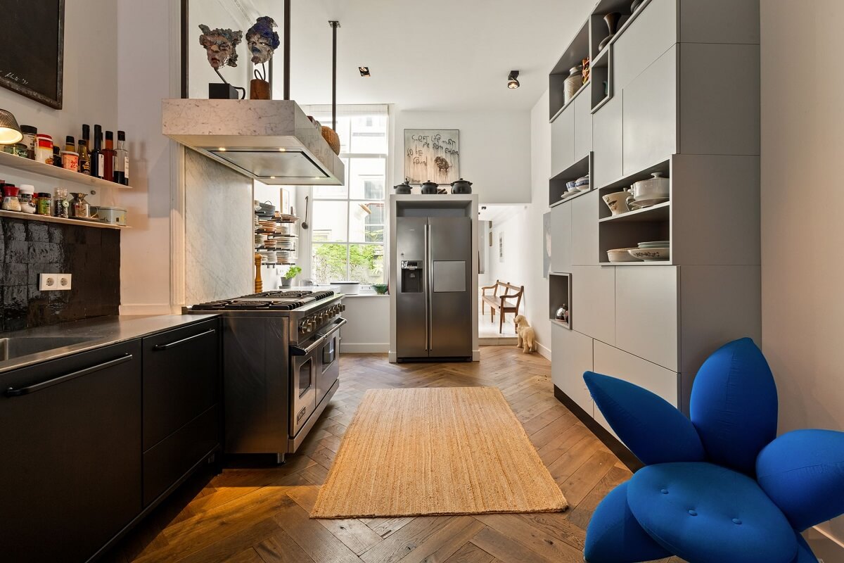 A Family Home in a Historic Canal House 6 black-gray-kitchen-cabinets-blue-chair-nordroom