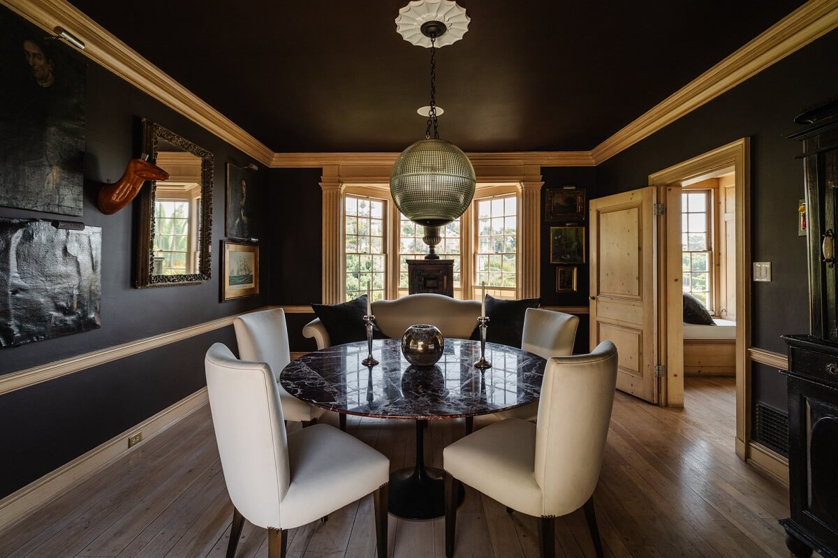 Black Accents in a Traditional Los Angeles Home 16 black-walls-ceiling-dining-room-with-round-dining-table-nordroom