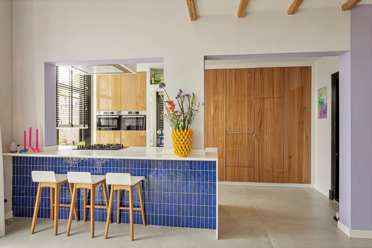 A Colorful School Conversion in The Netherlands 5 blue-tiled-kitchen-island-bar-nordroom