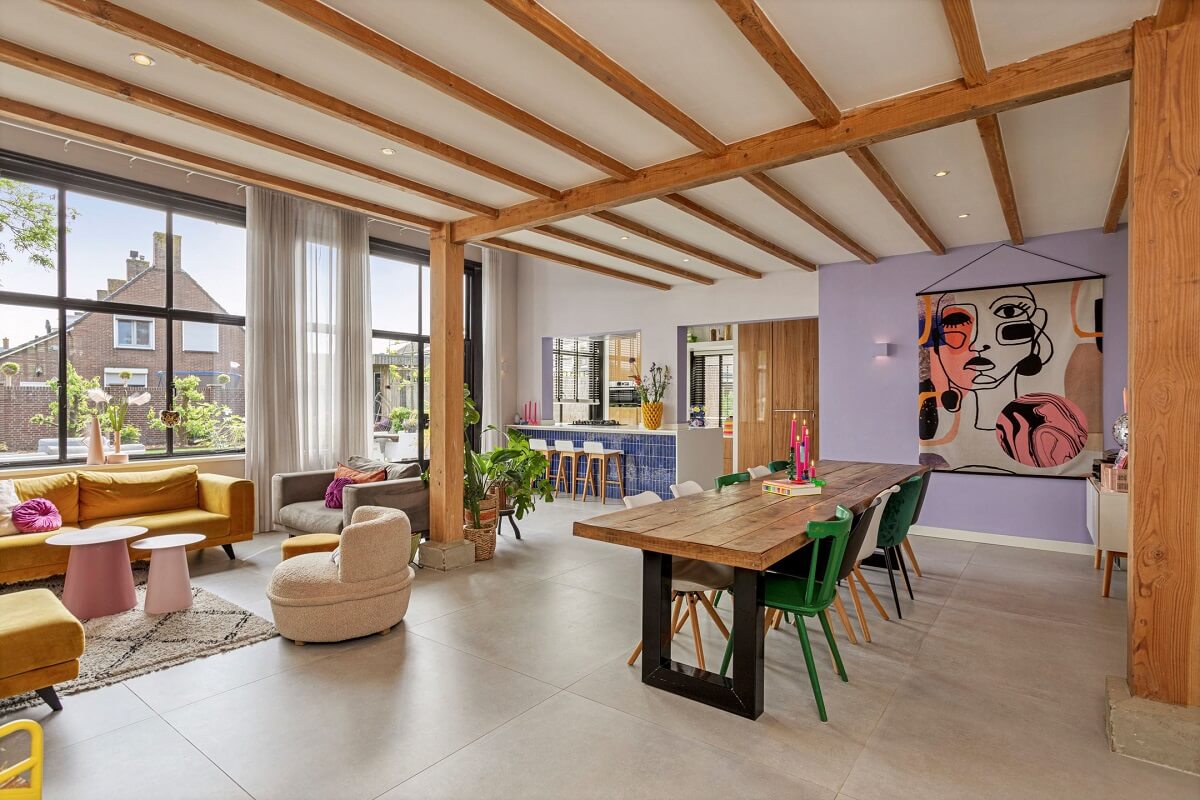 A Colorful School Conversion in The Netherlands 2 colorful-open-plan-living-space-school-conversion-wooden-beams-nordroom