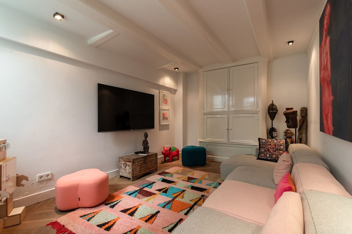 A Family Home in a Historic Canal House 19 colorful-rug-basement-familtfamily-room-nordroom
