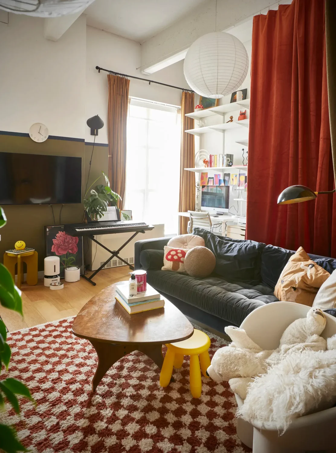 53 Studio Apartments with a Curtain Room Divider 19 colorful-studio-apartment-blood-orange-curtain-behind-sofa-nordroom
