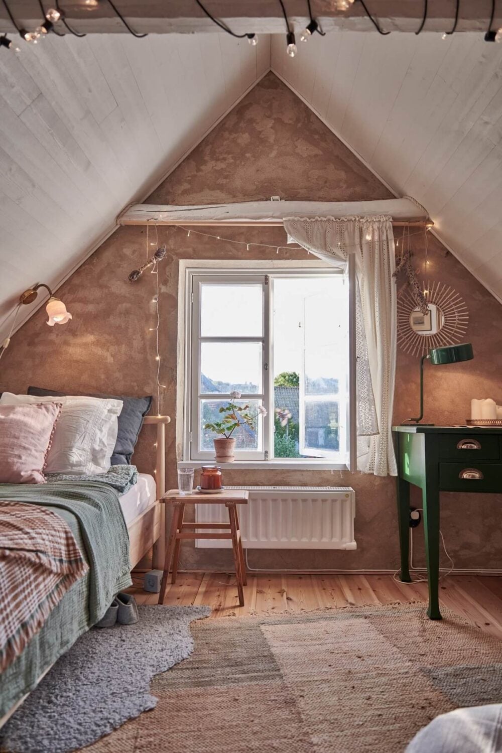 Natural Light in a Charming Swedish Country House 21 cozy-attic-bedroom-slanted-ceiling-nordroom