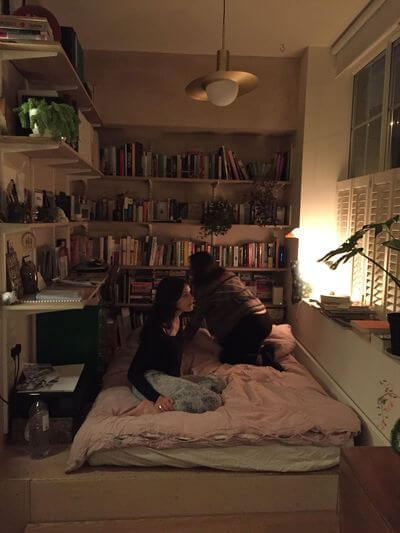 53 Studio Apartments with a Curtain Room Divider 30 cozy-bed-area-bookshelves-nordroom