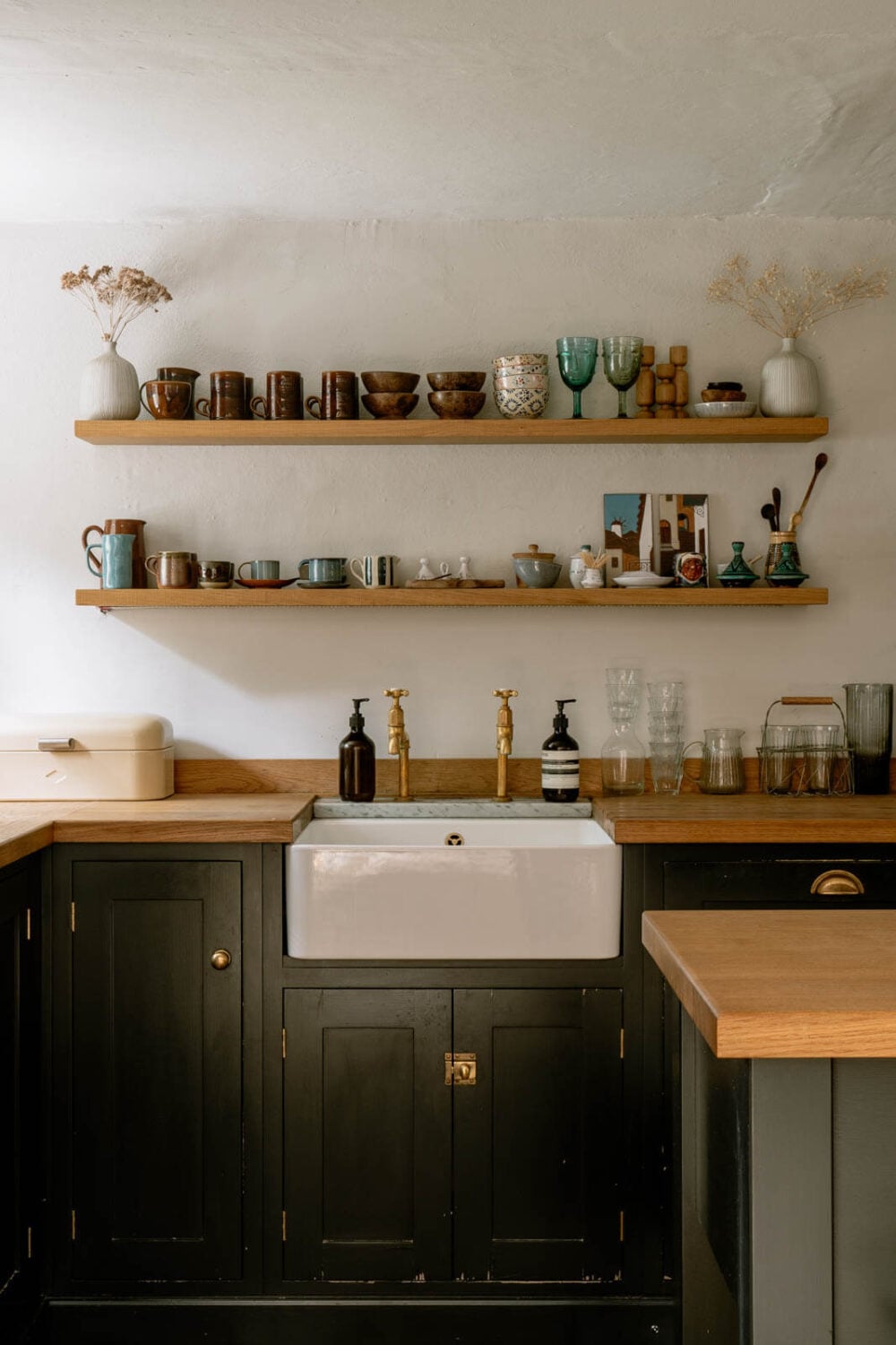 A Warm Living Room in a Historic English Home 9 dark-blue-devol-kitchen-cabinets-shelves-nordroom