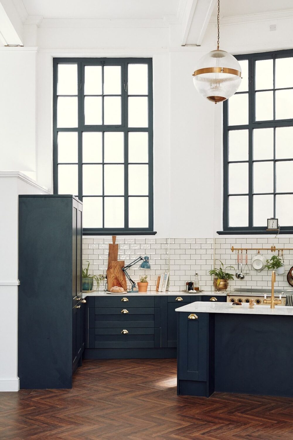 Loft Style Spaces in a Renovated Salvation Army Hall 7 dark-blue-kitchen-high-ceilings-large-windows-nordroom
