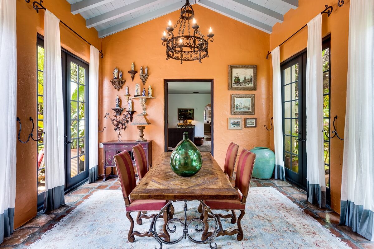 A Beautiful Spanish Style Home in Florida 17 dining-room-pitched-ceiling-terracotta-orange-walls-nordroom