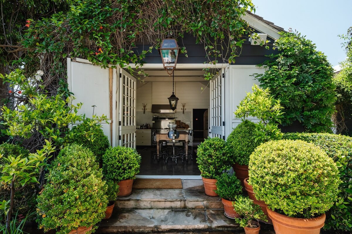 Black Accents in a Traditional Los Angeles Home 39 double-doors-garden-kitchen-view-nordroom