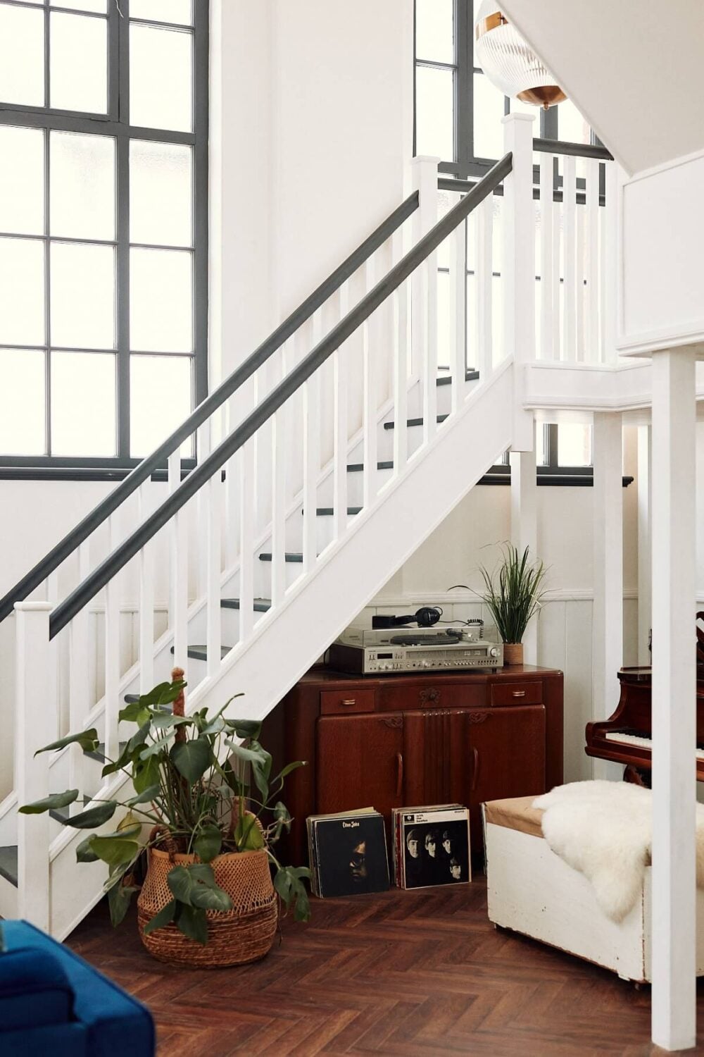 Loft Style Spaces in a Renovated Salvation Army Hall 5 double-height-loft-style-living-room-staircase-nordroom