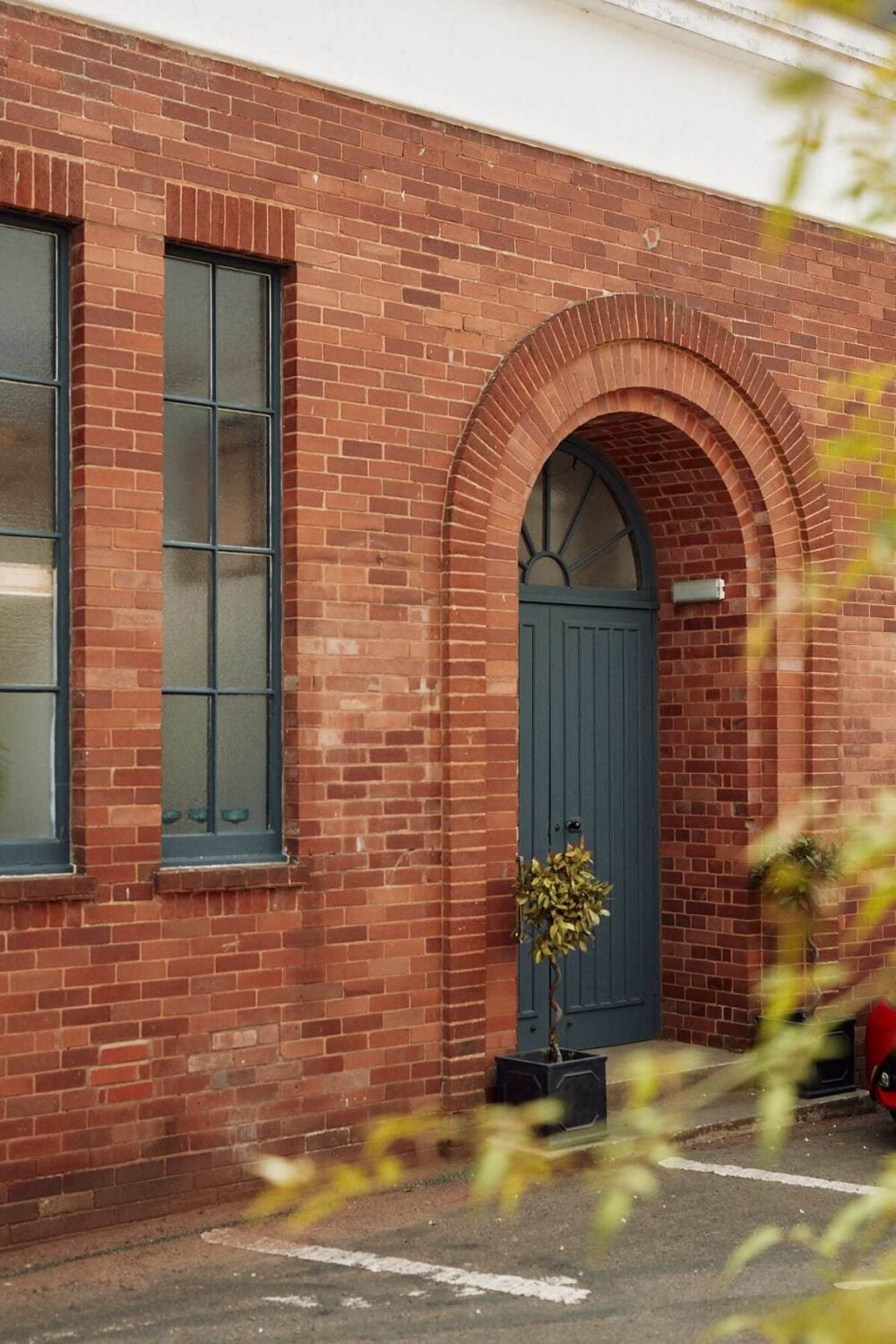 Loft Style Spaces in a Renovated Salvation Army Hall 22 entry-loft-style-home-england-farrow-ball-hague-blue-front-door-nordroom