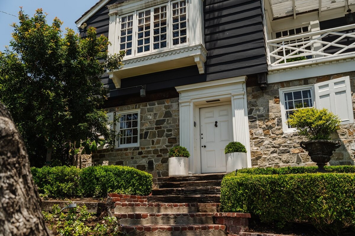 Black Accents in a Traditional Los Angeles Home 50 exterior-wood-stone-los-angeles-home-nordroom