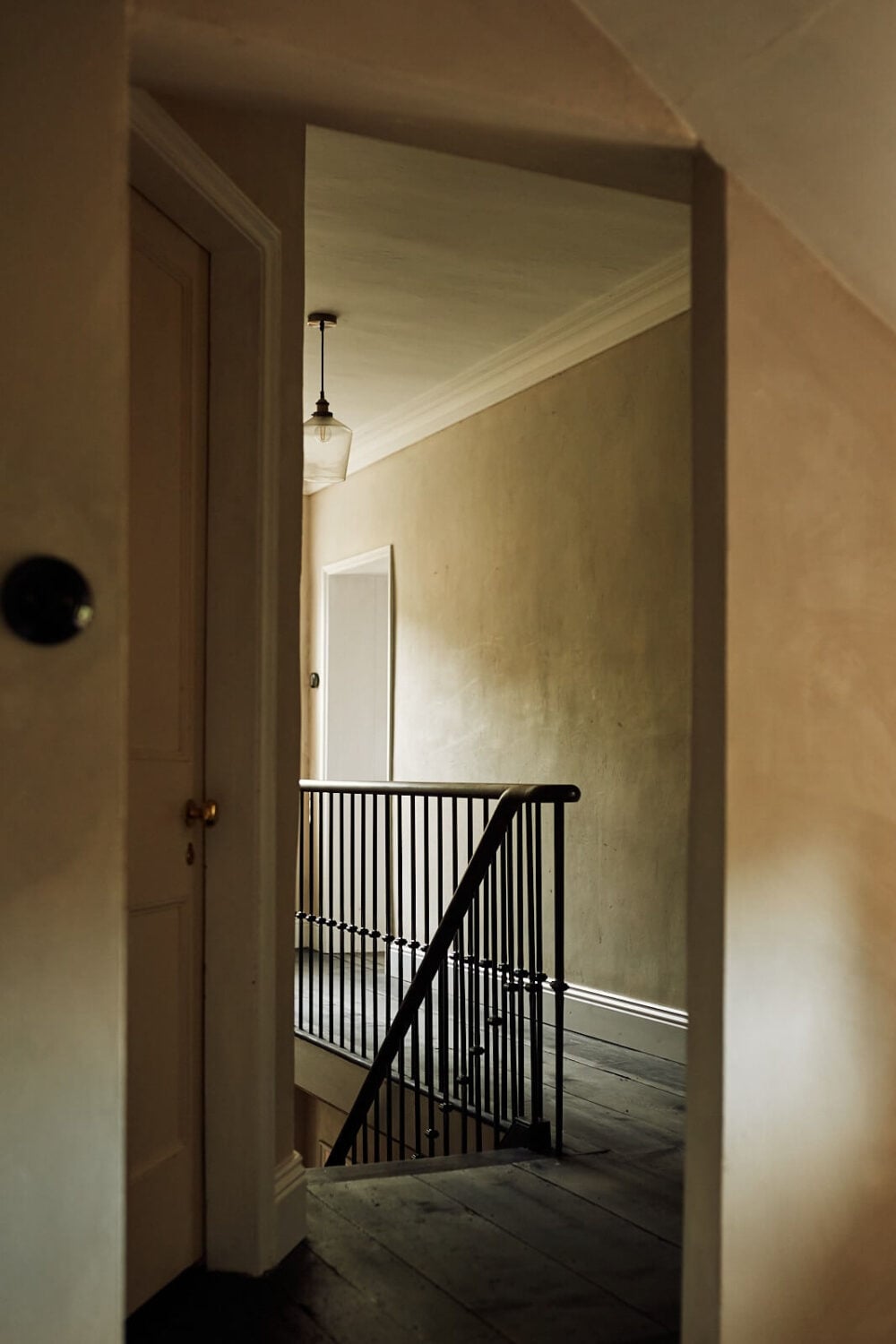 An English Cottage with a Perfect Kitchen 22 first-floor-landing-black-floorboards-nordroom