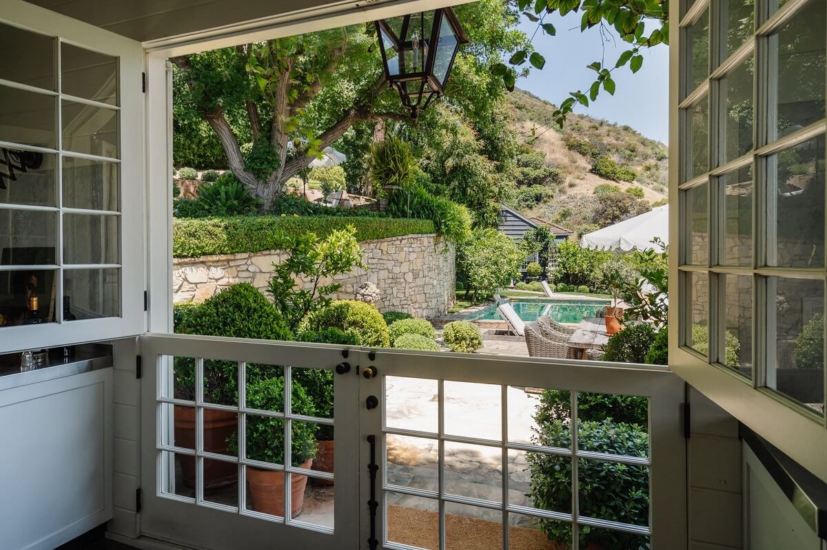 Black Accents in a Traditional Los Angeles Home 5 glass-dutch-door-garden-view-nordroom