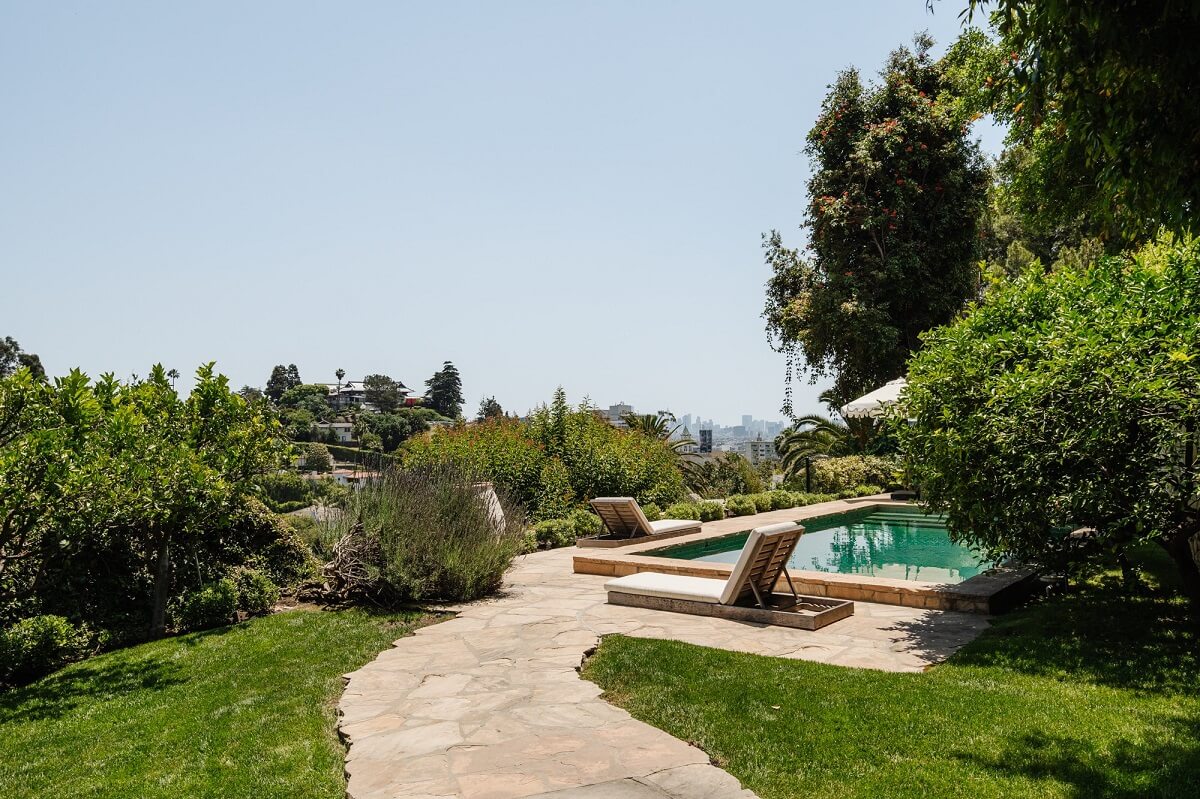 Black Accents in a Traditional Los Angeles Home 37 green-garden-swimming-pool-nordroom