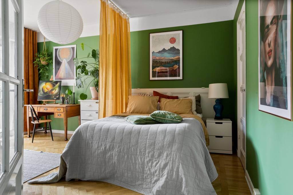 How To Decorate A Studio Apartment 62 green-studio-apartment-yellow-curtain-room-divider-nordroom