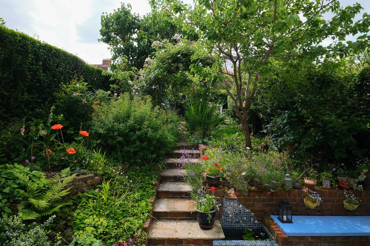 An English Cottage with Blue Color Accents 21 green-terraced-cottage-garden-nordroom