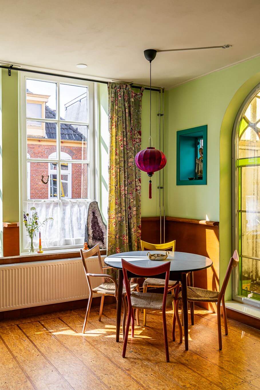A Colorful Church Conversion in The Netherlands 8 green-walls-living-room-round-dining-table-nordroom