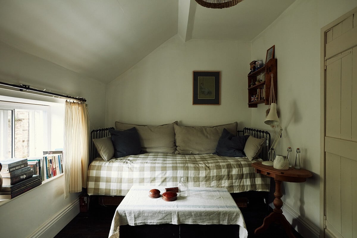 An English Cottage with a Perfect Kitchen 23 guest-bedroom-sofa-bed-slanted-ceiling-nordroom