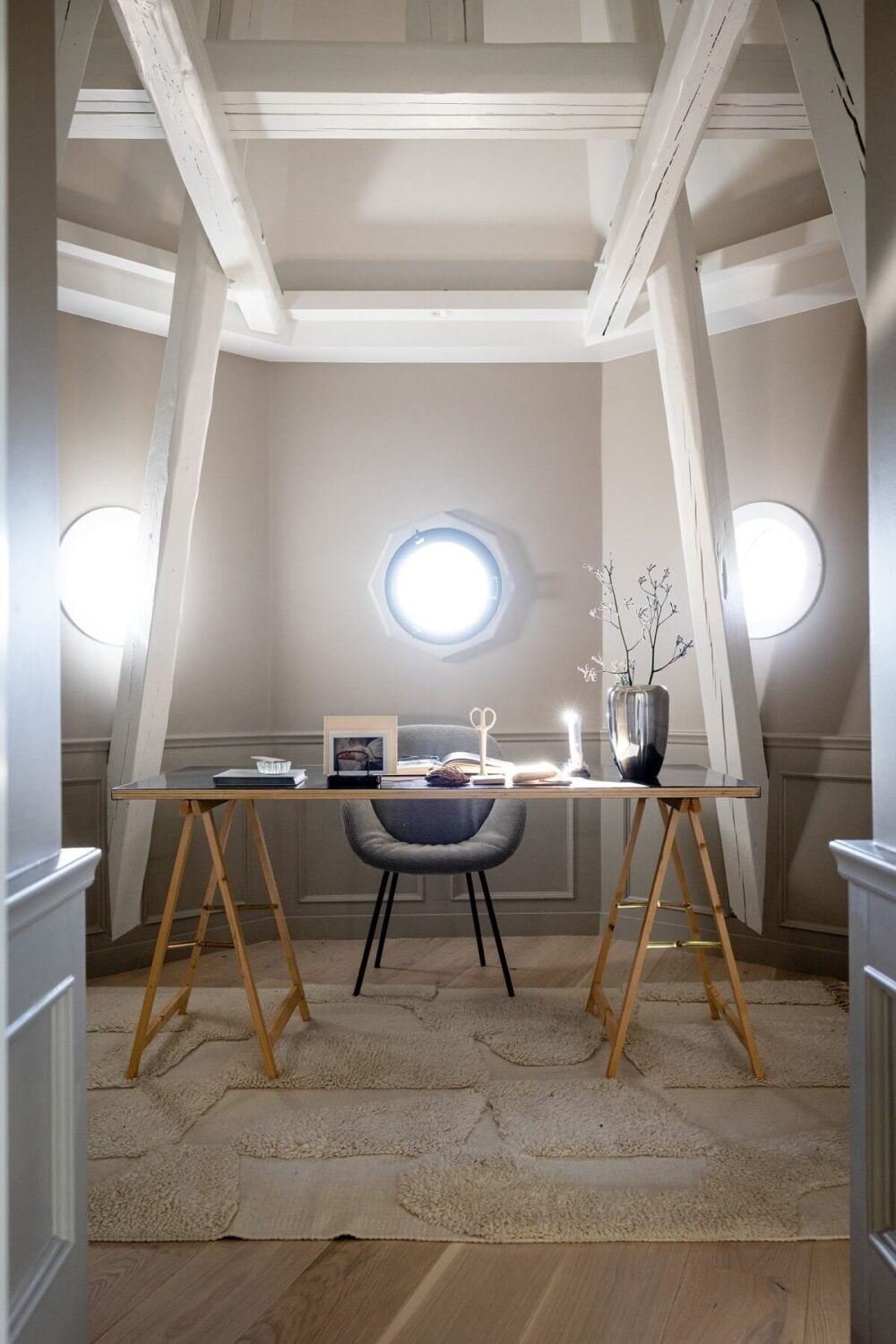 A Bright Penthouse Apartment in Oslo 10 home-office-round-windows-exposed-beams-nordroom