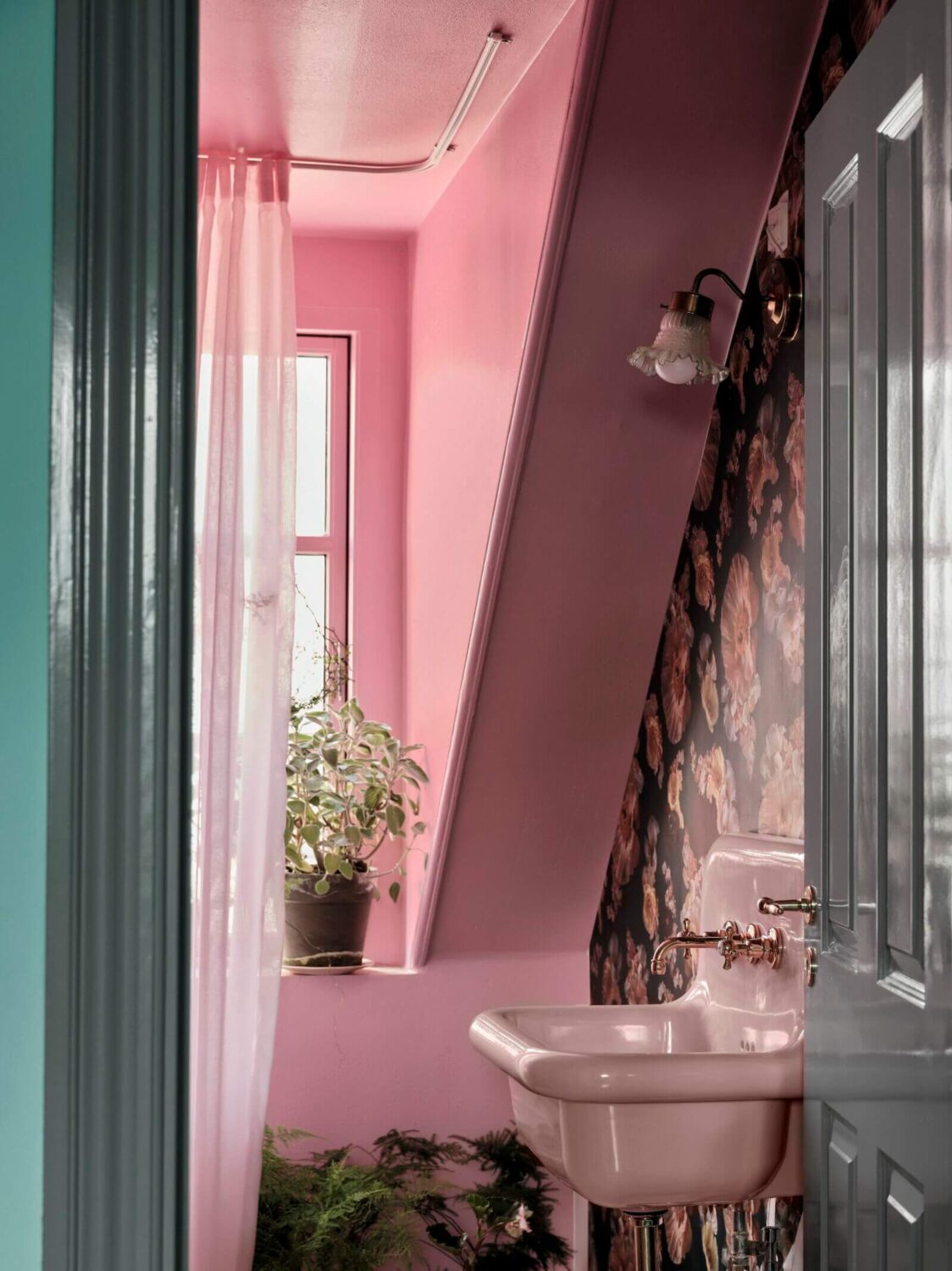 89 Pink Bathroom Ideas: From Hot Pink Walls to Blush Tiles 14 hot-pink-bathroom-slanted-ceiling-floral-wallpaper-nordroom