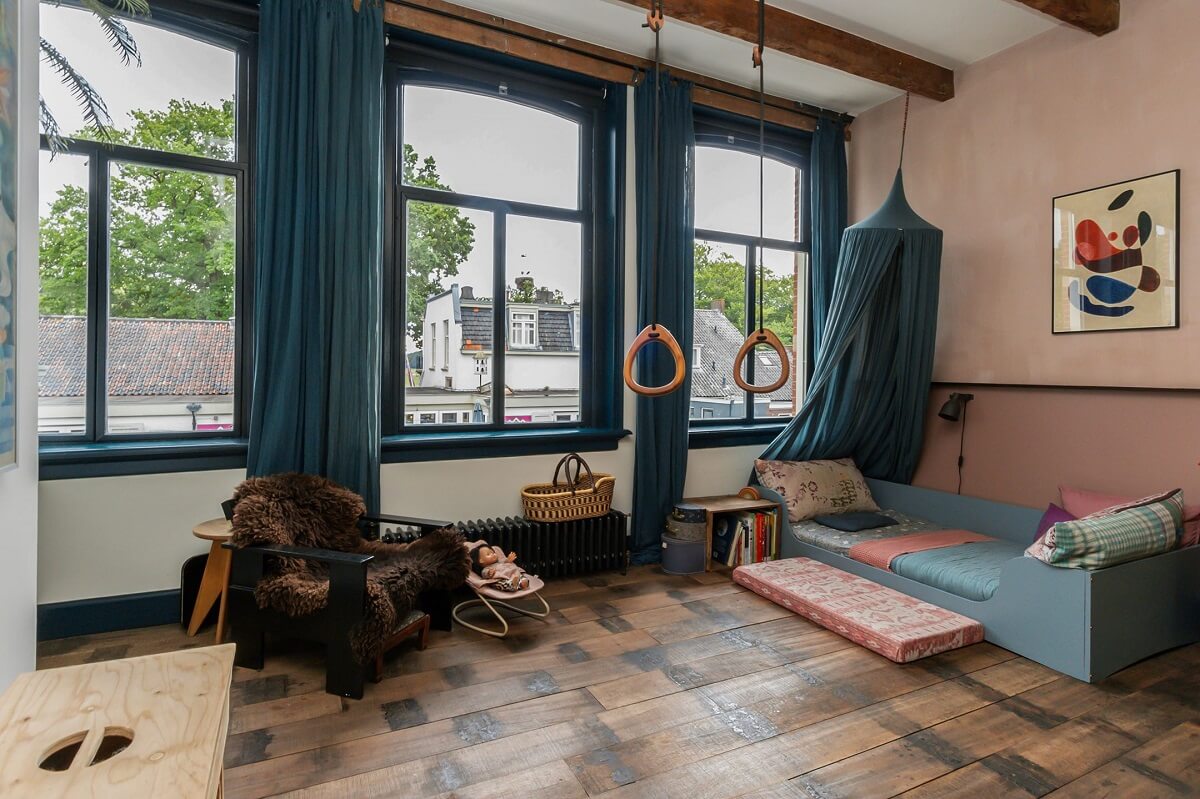 A Charming Colorful House in The Netherlands 15 kids-bedroom-half-painted-pink-wall-blue-color-accents-nordroom