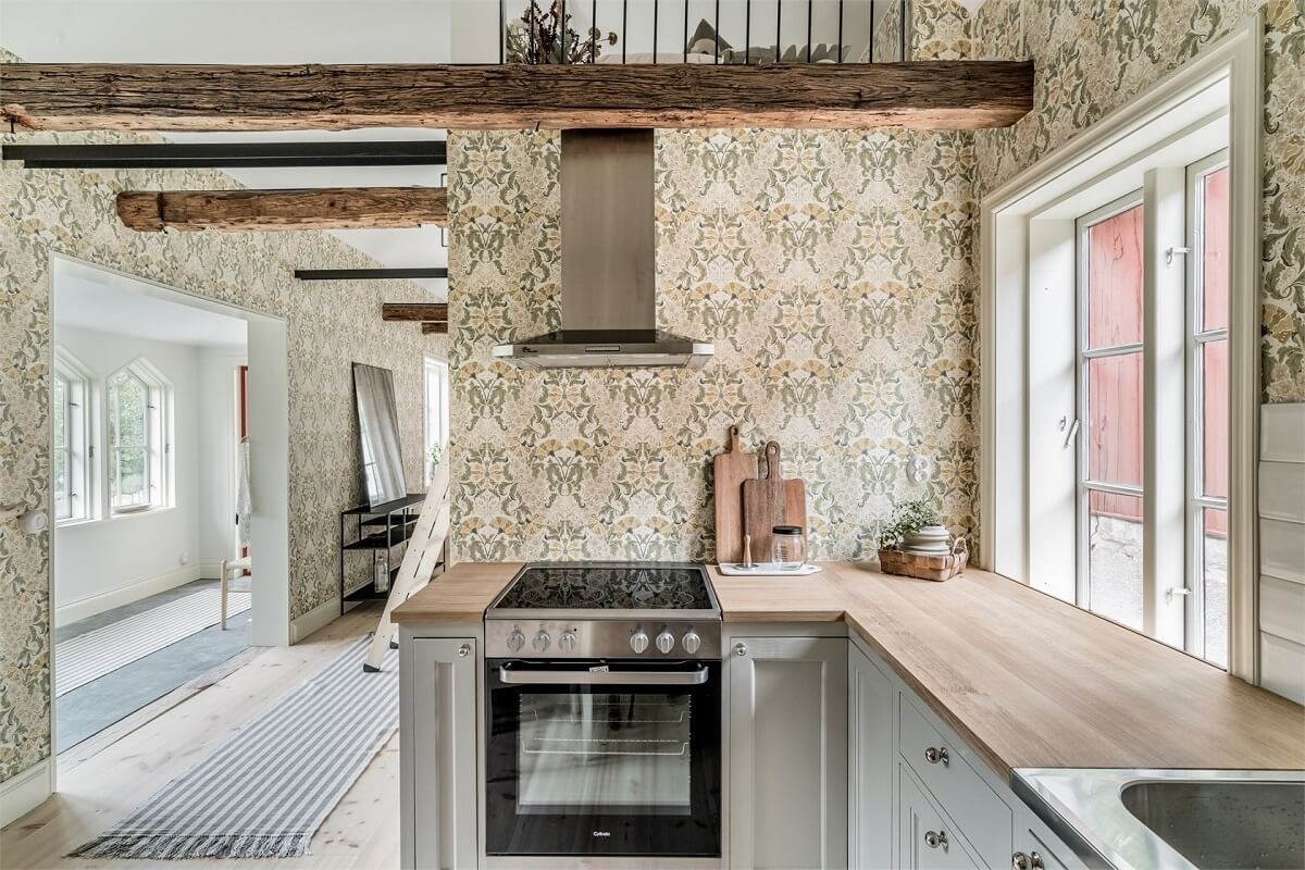 An Idyllic Small Swedish House with Wooden Beams 9 kitchen-exposed-wooden-beam-wallpaper-nordroom