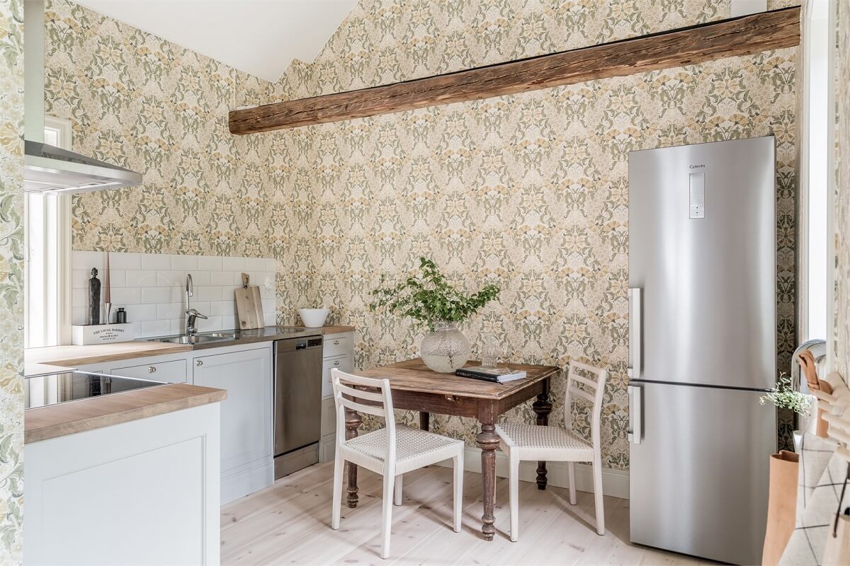 An Idyllic Small Swedish House with Wooden Beams 8 kitchen-rustic-wooden-dining-table-exposed-wooden-beam-wallpaper-nordroom