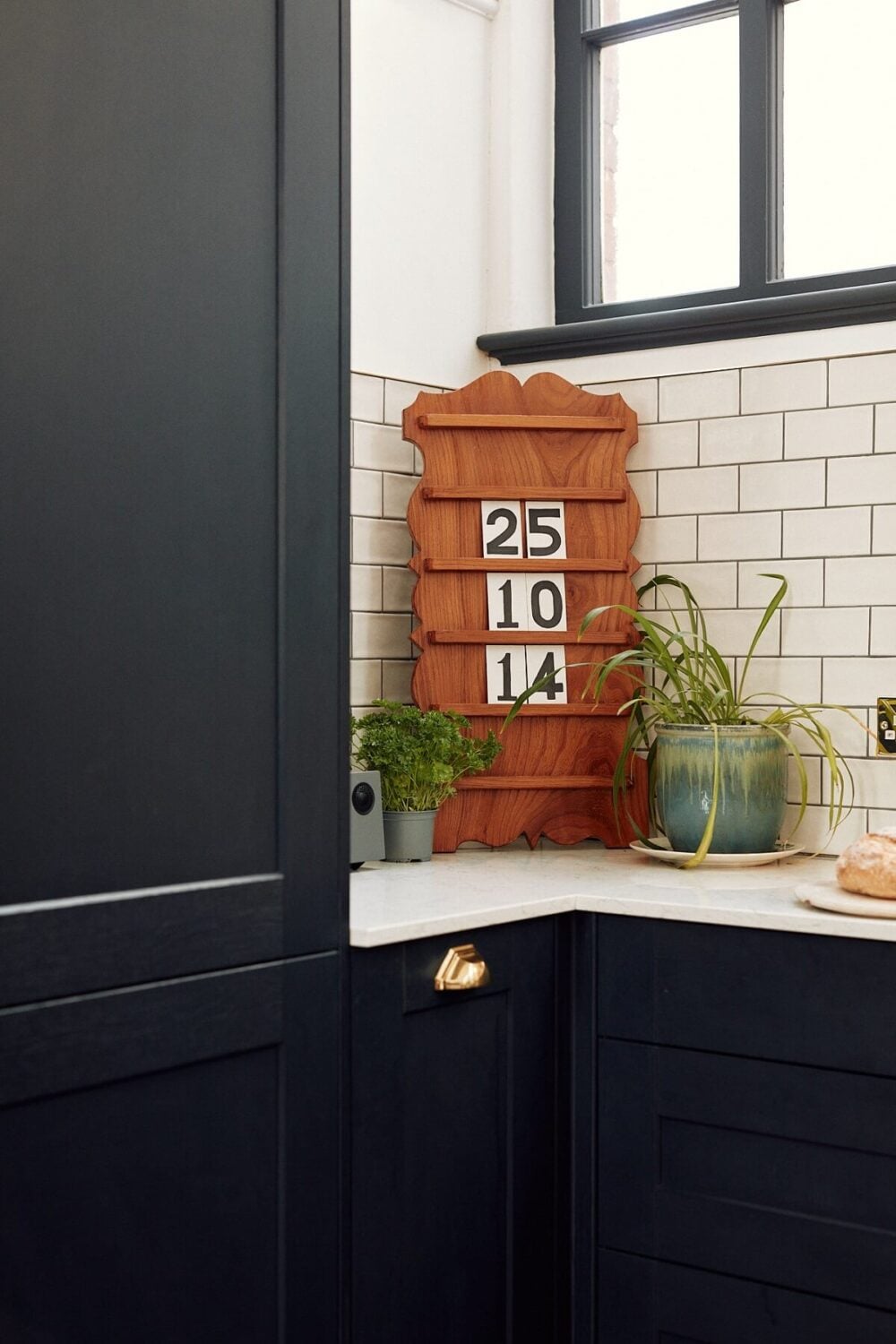 Loft Style Spaces in a Renovated Salvation Army Hall 9 kitchen-white-subway-tiles-dark-blue-cabinets-nordroom