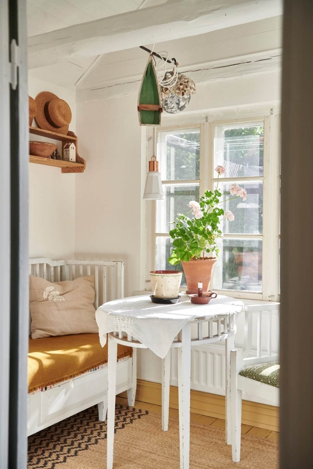 Natural Light in a Charming Swedish Country House 2 light-living-space-bench-yellow-seating-nordroom