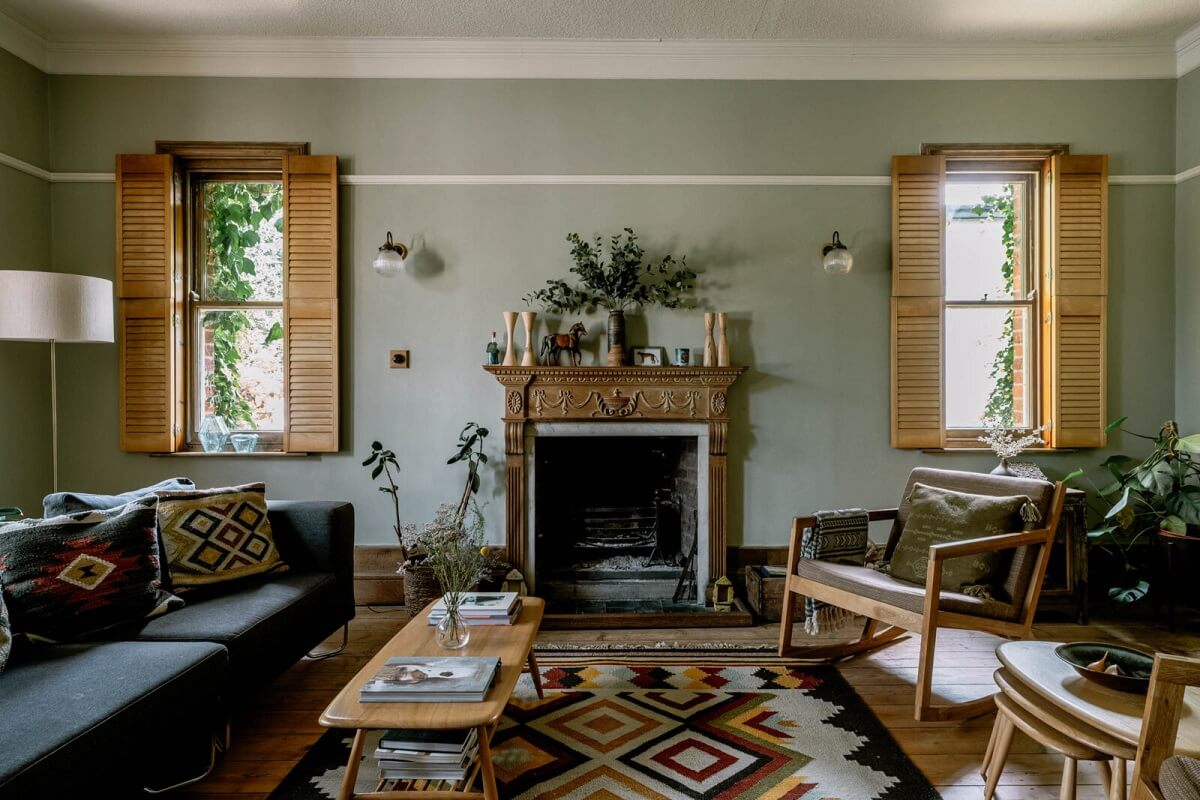 A Warm Living Room in a Historic English Home 3 living-room-carved-fireplace-bohemian-accents-nordroom