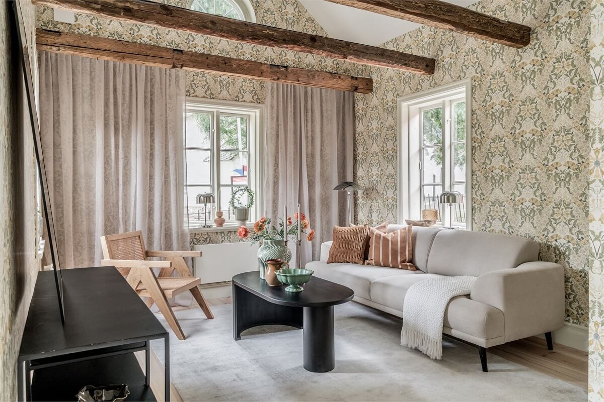 An Idyllic Small Swedish House with Wooden Beams 4 living-room-exposed-wooden-beams-pitched-ceiling-nordroom