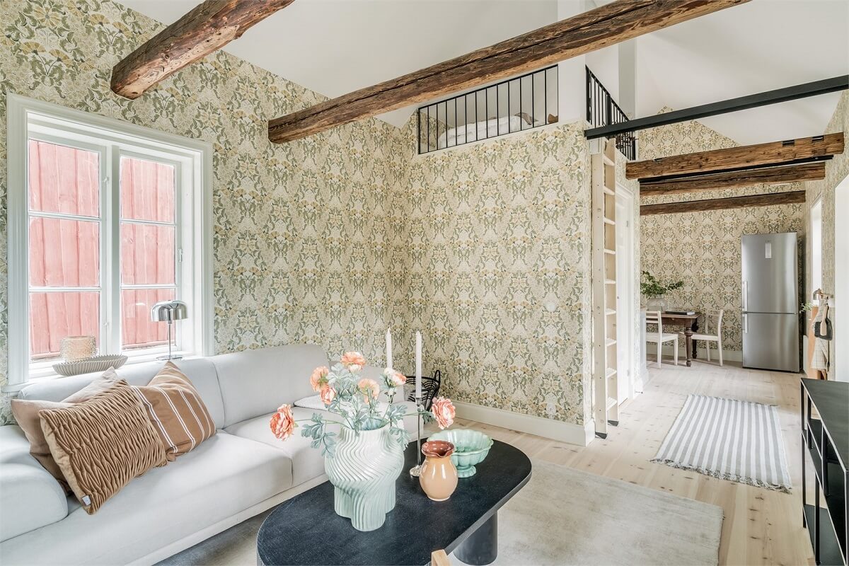 An Idyllic Small Swedish House with Wooden Beams 5 living-room-exposed-wooden-beams-sleeping-loft-nordroom