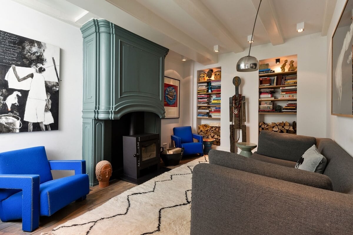 A Family Home in a Historic Canal House 8 living-room-green-fireplace-mantel-built-in-bookshelves-nordroom