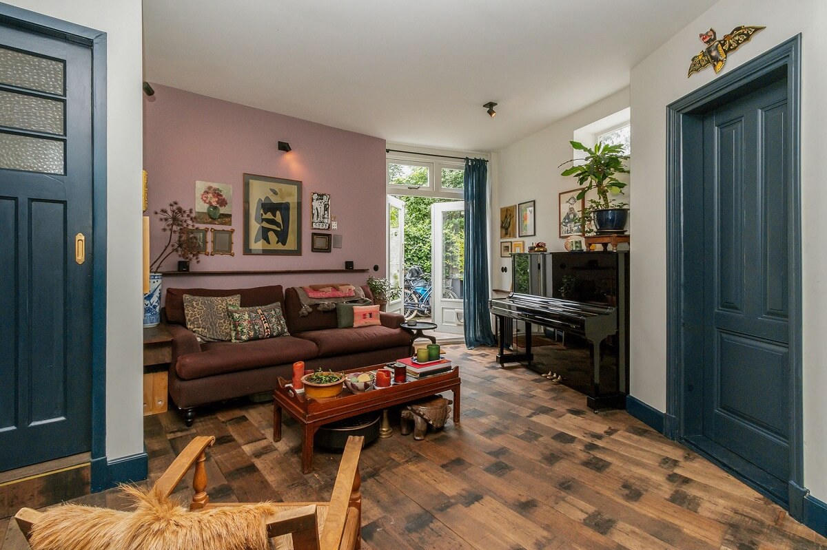 A Charming Colorful House in The Netherlands 8 living-room-lavender-accent-wall-blue-painted-doors-nordroom