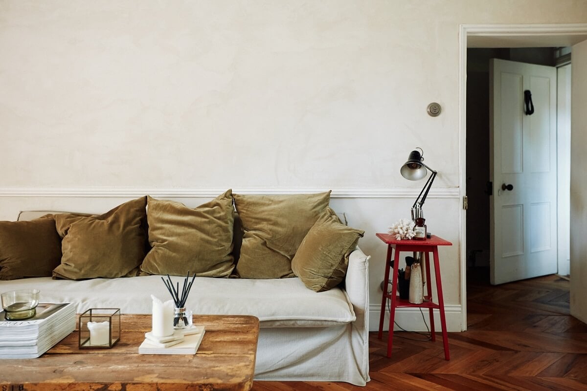 An English Cottage with a Perfect Kitchen 3 living-room-reclaimed-wooden-floor-green-cushions-nordroom