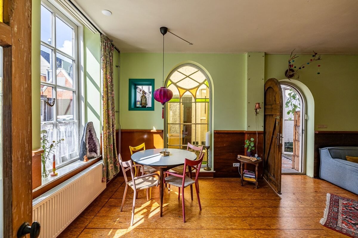 A Colorful Church Conversion in The Netherlands 7 living-room-round-dining-table-wooden-floor-green-walls-church-conversion-nordroom