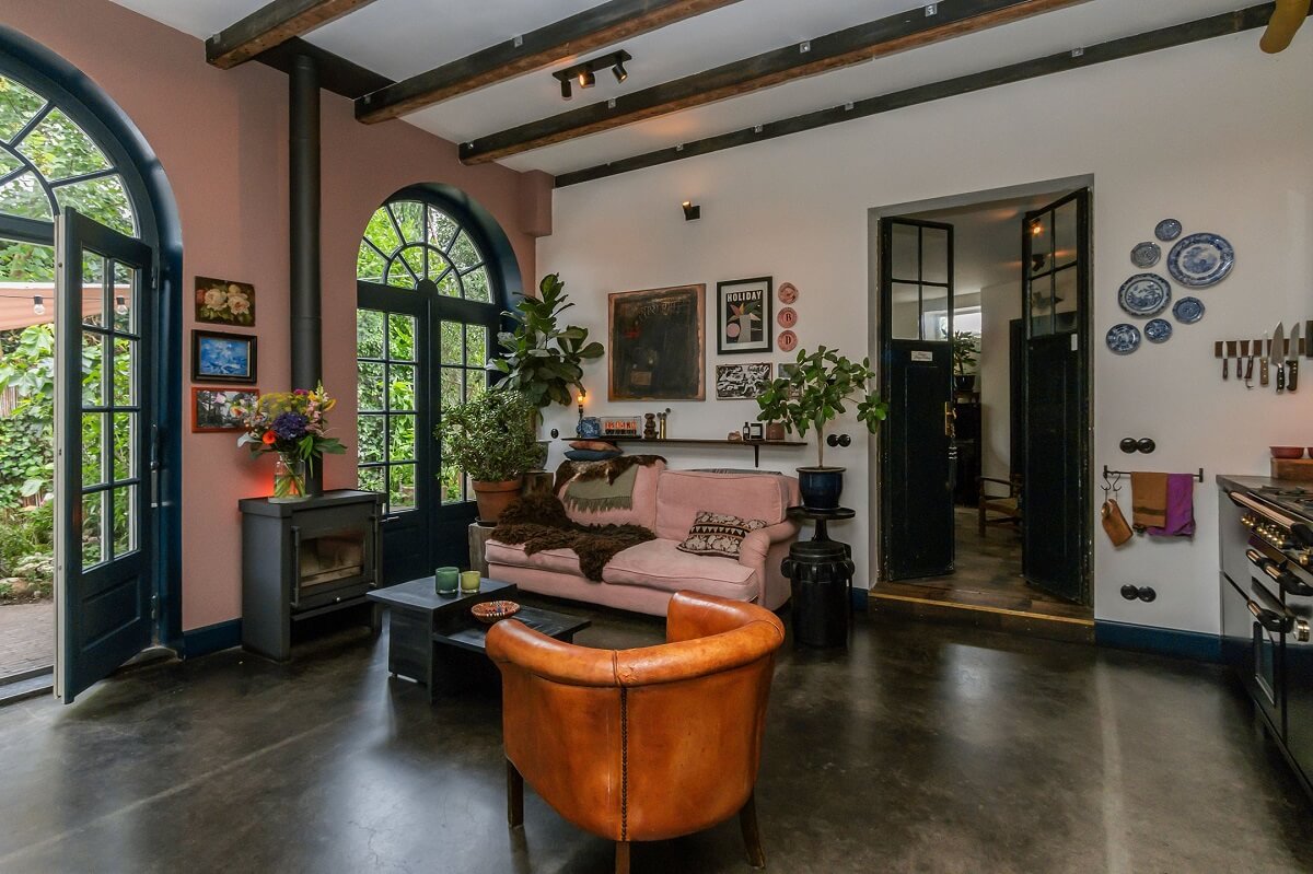 A Charming Colorful House in The Netherlands 5 living-room-woodburner-pink-wall-nordroom