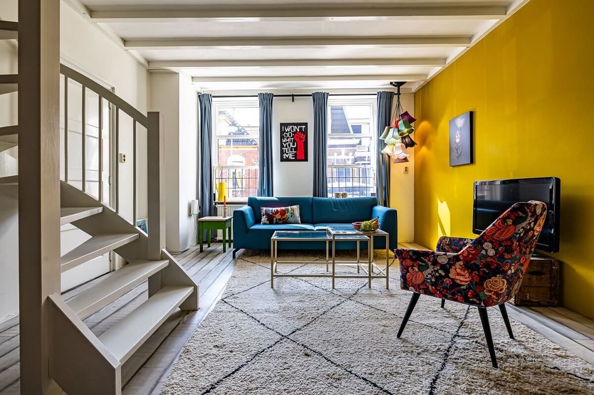 A Colorful Church Conversion in The Netherlands 17 living-room-yellow-wall-nordroom