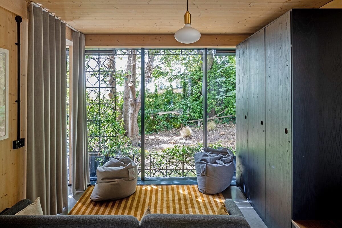 A Modern English Home with a Sculptural Facade 9 living-space-garden-view-trees-nordroom