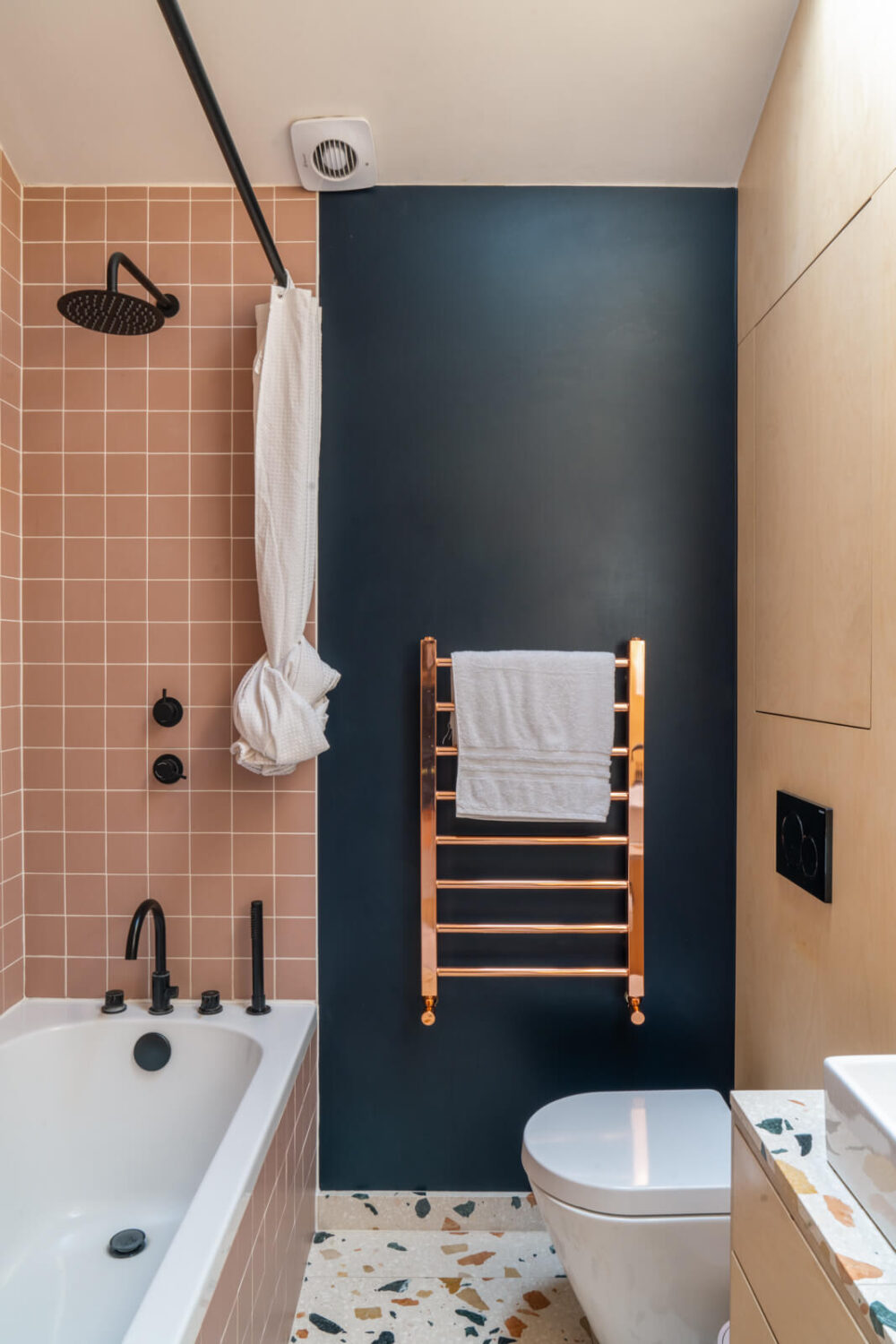 89 Pink Bathroom Ideas: From Hot Pink Walls to Blush Tiles 26 modern-bathroom-pink-tiles-blue-wall-terrazzo-floor-tiles-nordrom