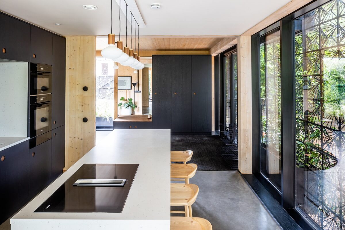 A Modern English Home with a Sculptural Facade 13 modern-kitchen-island-breakfast-bar-nordroom