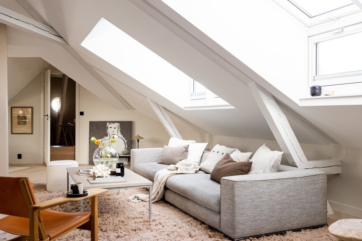 A Bright Penthouse Apartment in Oslo 3 modern-light-living-room-slanted-ceiling-nordroom