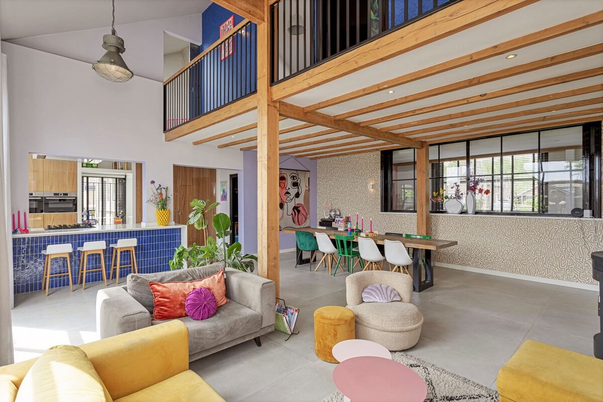 A Colorful School Conversion in The Netherlands 1 open-plan-double-height-living-space-school-conversion-nordroom