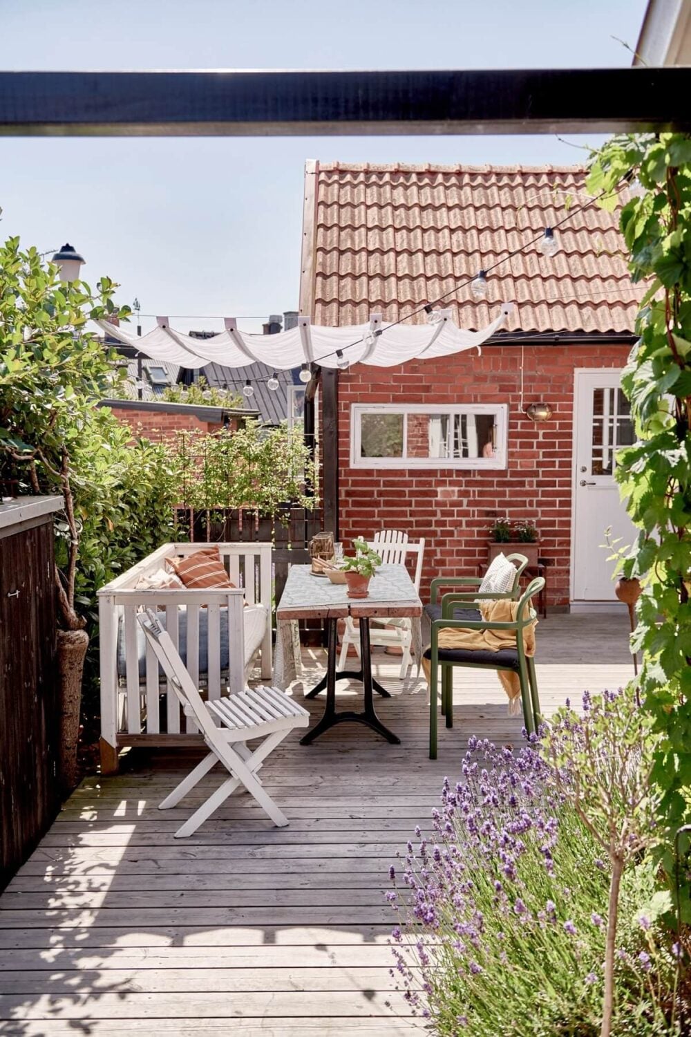 Natural Light in a Charming Swedish Country House 28 outdoor-dining-space-swedish-house-nordroom