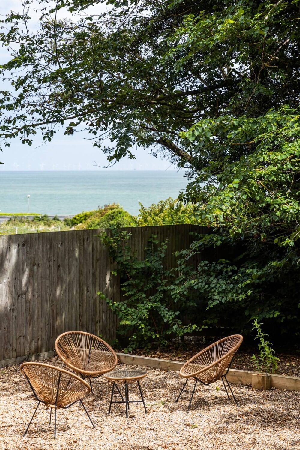 A Modern English Home with a Sculptural Facade 23 outdoor-terrace-sea-view-england-nordroom