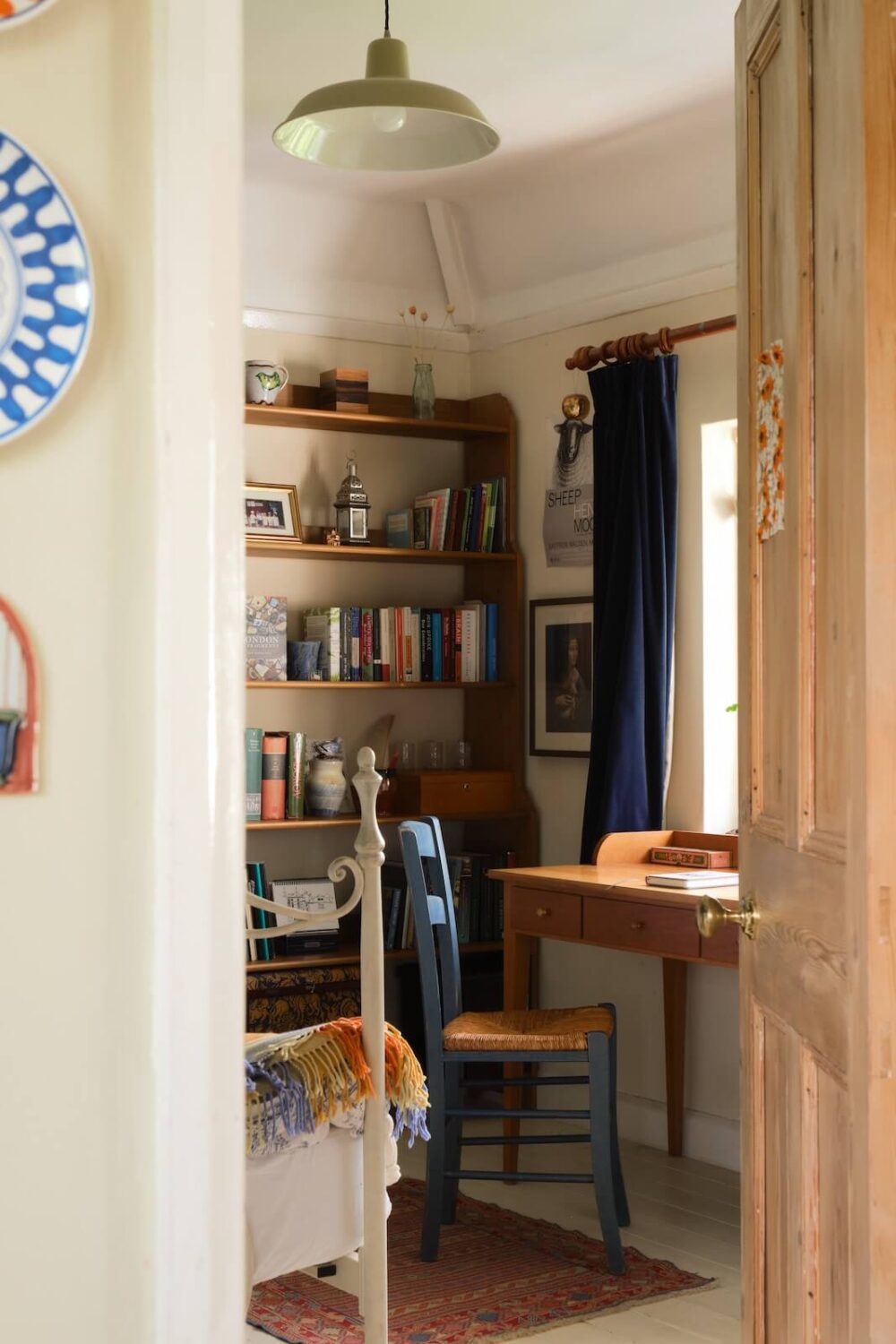 An English Cottage with Blue Color Accents 13 peek-into-guest-bedroom-with-desk-nordroom
