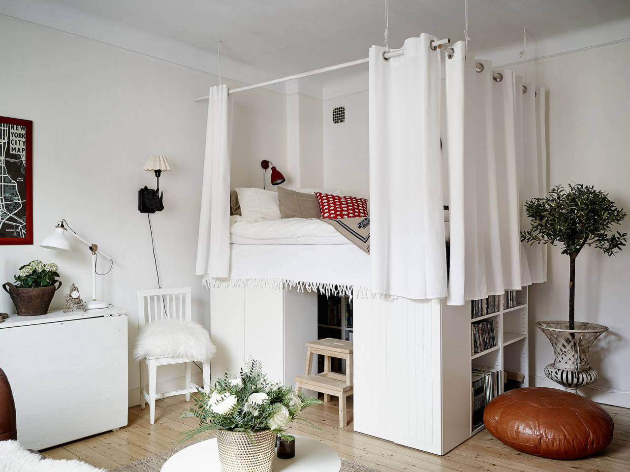 53 Studio Apartments with a Curtain Room Divider 51 raised-loft-bed-storage-bookshelves-curtain-around-bed-nordroom