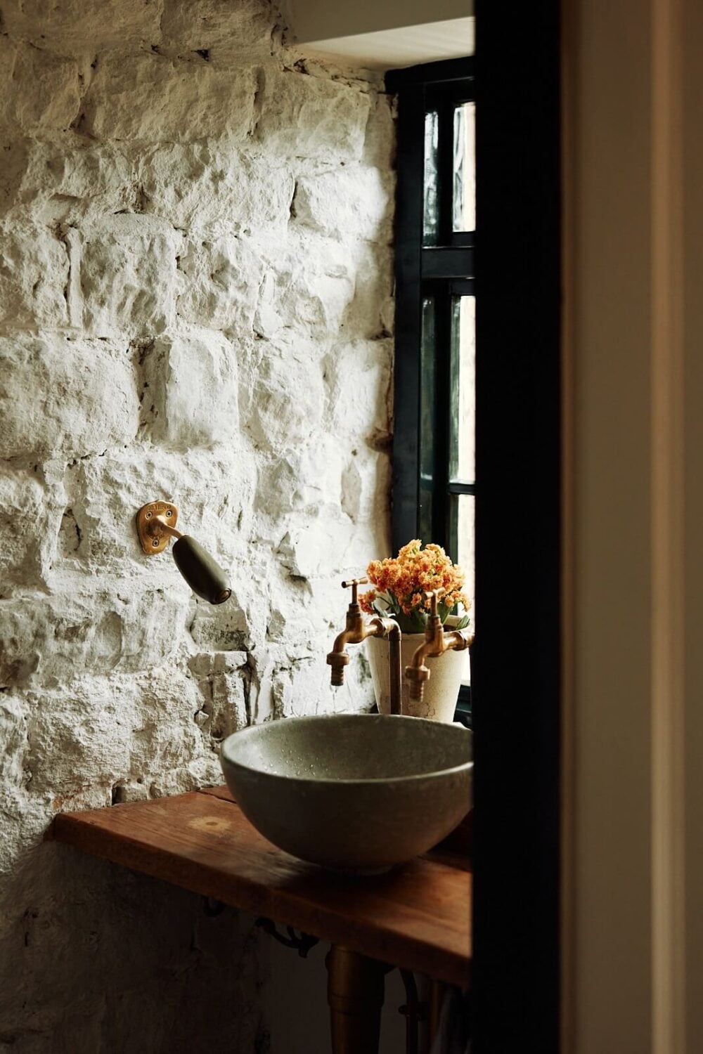 An English Cottage with a Perfect Kitchen 13 round-sink-stone-wall-nordroom