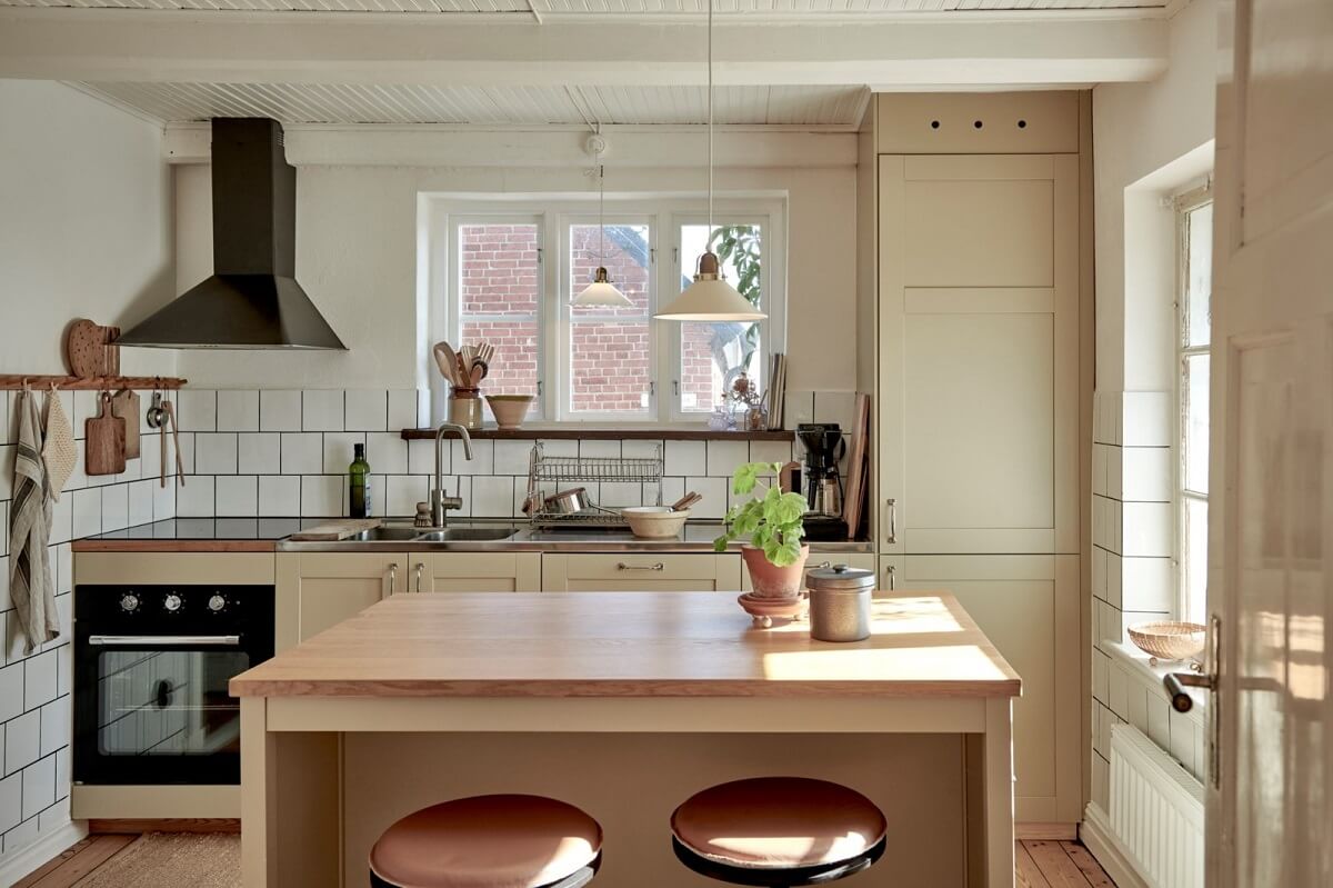 Natural Light in a Charming Swedish Country House 8 scandinavian-kitchen-white-tiles-island-bar-stools-nordroom
